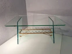 Pamono Coffee Table with Glass Top and Legs and Brass Scrolls attributed to Gio Ponti for Fontana Arte, 1940s Online