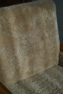 Pamono Danish Modern Lounge Chairs in Oak and Shearling Lambswool by Henning Kjærnulf, 1960s, Set of 2 Outlet