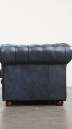 Pamono Fantastic 2-Seater Leather Chesterfield Sofa with a Denim Blue Colour.