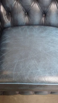 Pamono Fantastic 2-Seater Leather Chesterfield Sofa with a Denim Blue Colour.