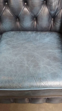 Pamono Fantastic 2-Seater Leather Chesterfield Sofa with a Denim Blue Colour.