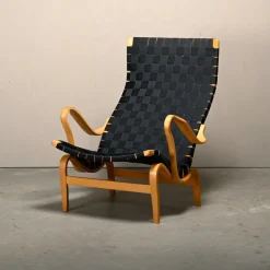 Pamono Set of Pernilla Easy Chair and Ottoman in Beech and Black Upholstery by Bruno Mathsson for Dux, 1970s Clearance