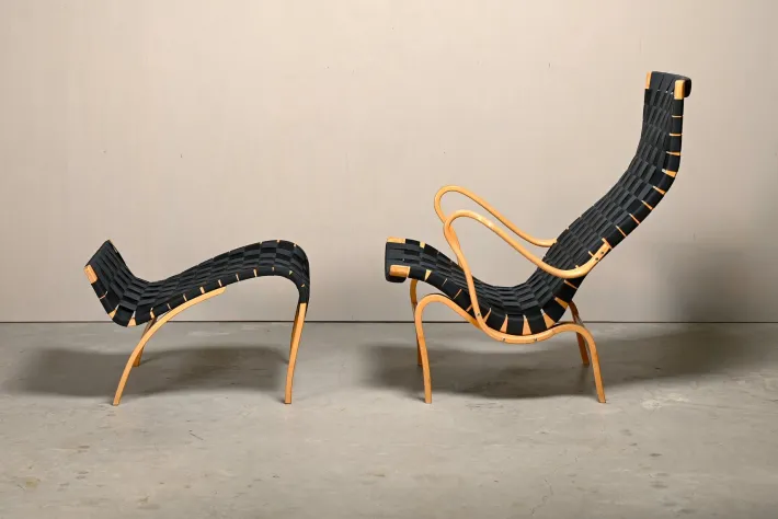 Pamono Set of Pernilla Easy Chair and Ottoman in Beech and Black Upholstery by Bruno Mathsson for Dux, 1970s Clearance