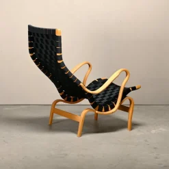 Pamono Set of Pernilla Easy Chair and Ottoman in Beech and Black Upholstery by Bruno Mathsson for Dux, 1970s Clearance