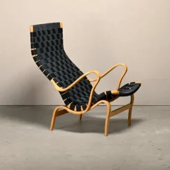 Pamono Set of Pernilla Easy Chair and Ottoman in Beech and Black Upholstery by Bruno Mathsson for Dux, 1970s Clearance