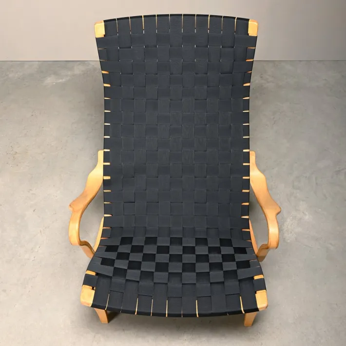 Pamono Set of Pernilla Easy Chair and Ottoman in Beech and Black Upholstery by Bruno Mathsson for Dux, 1970s Clearance